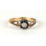 A 9ct gold sapphire and diamond cluster ring, approx UK size 'P', 1.2g.Condition ReportMissing one