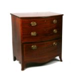 A 19th century mahogany bowfronted commode chest (converted) with lift-up top above two faux drawers