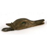 A brass duck head letters clip, 14cms long.