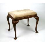 A walnut stool on cabriole legs with drop-in upholstered seat, 54cms wide.