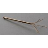 A 9ct gold swizzle stick, 9cms long.Condition ReportThe central stick with the bead end is
