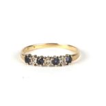 A 9ct gold diamond and sapphire ring, approx UK size 'O', 1.3g.