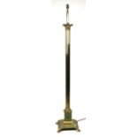 A George III style brass standard lamp with Corinthian column on a square base with lions paw