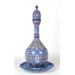 A Persian enamel lidded wine vessel on stand, 46cms high.