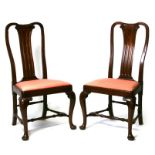 A pair of 18th century style mahogany chairs with upholstered drop-in seats, on cabriole legs and