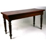 A 19th century mahogany serving table on reeded turned legs, 136cms wide.Condition Report136cm