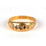 An 18ct gold gypsy ring set with white stones, approx UK size 'O', 2.2g.Condition Report One diamond