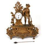 A late 19th century French gilt spelter figural mantle clock, the white porcelain dial with Roman