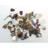 An assortment of WW1 & WW2 sweetheart brooches and badges mainly for spares and repair