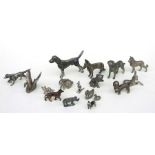 A group of metal animals to include dogs, birds and a donkey, the largest 8cms high.