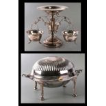 A silver plated dome topped breakfast dish, 34cms wide; together with a silver plated centrepiece