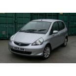 A 2005 Honda Jazz SE 5-door hatchback, registration no. WV05 HNW, silver. This lady owned Honda Jazz