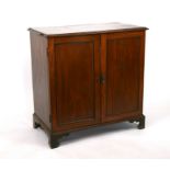 A late 19th century mahogany two-door cupboard on bracket feet, 82cms wide.Condition Report There is