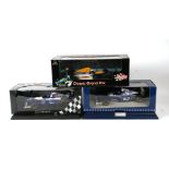 Three F1 World Champion Cars and Drivers 1:18 scale diecast models comprising Quartzo Williams