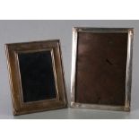 Two modern silver strut photo frames, the largest overall 16 by 21cms (2).