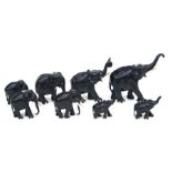 A group of carved ebony elephants, the largest 20cms high (8).