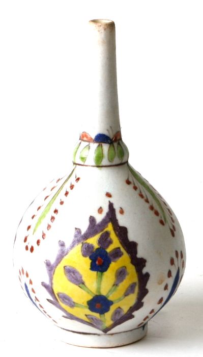 A Turkish Kutahya rosewater dropper decorated with stylised flowers, 15cms high.