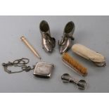 A silver vesta case; together with two pewter novelty shoe form pin cushions; a moustache brush; a