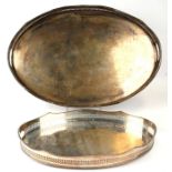 A large silver plated galleried two-handled oval tray, 62cms wide; together with a similar
