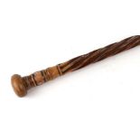 An 18th / 19th century walking cane with wrythen shaft inlaid with mother of pearl roundels, 85cms