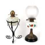 A Victorian oil lamp on brass column with glass reservoir painted with flowers; together with a