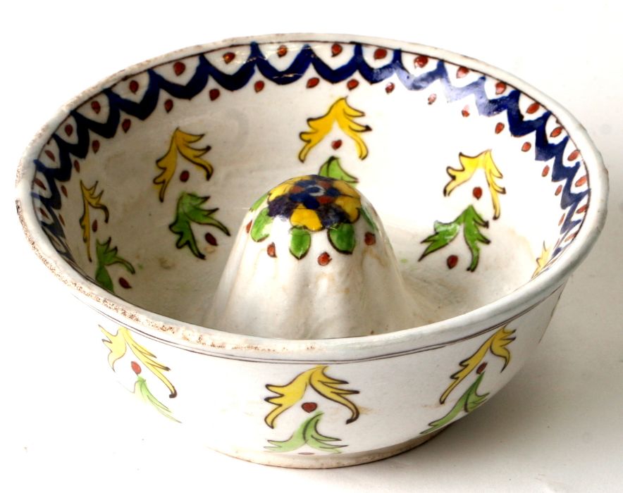 A Turkish Kutahya potter lemon squeezer, 15cms diameter.