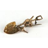 A Victorian 9ct gold South African miner's brooch with crossed pick and shovel, bucket and nugget,