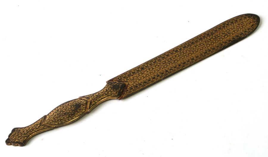 An Indo-Persian letter opener with yellow metal inlay, 22cms long.