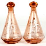 A pair of 1951 Festival of Britain pink glass decanters, 19cms high (2).