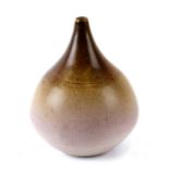 A Delan Cookson Studio vase of onion form with variegated brown glaze decoration, 15cms high.