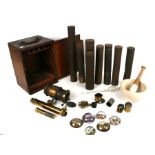 A mahogany microscope box containing microscope parts and lenses; together with a quantity of