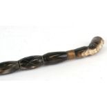 A sectional horn walking stick with Egyptian head terminal, 94cms long.