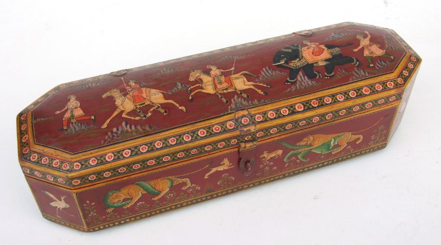 An Indian pen box of elongated octagonal form painted with figures and animals, 33cms wide.