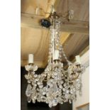 A six-arm chandelier with crystal drops, 67cms high.