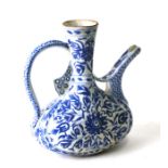 A Turkish Kutahya blue & white water ewer decorated with flowers, 22cms high.
