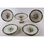 A Royal Worcester desert service decorated with foliate sprays within a green and gilt border,