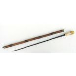 A bamboo sword stick with 59cms (23.25ins) triangular section steel blade with makers name HOSTIN