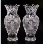 A pair of baluster form cut glass vases with shamrock engraved decoration, 26cms high; together with
