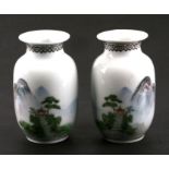 A pair of Chinese Republic style vases decorated with a mountainous landscape scene and calligraphy,