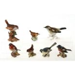 A Royal Worcester wren figure, no. 3198; together with five Beswick birds and a Karl Ens bird (7).
