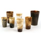 A group of tapering horn beakers, the largest 13cms high.