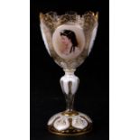 A Bohemian flashed glass oversized goblet with oval portrait miniature and flowers within panels