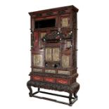 A fine quality Japanese Meiji period lacquer Shodana cabinet with carved dragon pediment above