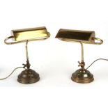A pair of brass bankers lamps, 39cms high.