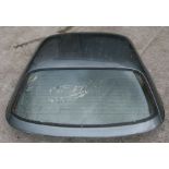 A gunmetal grey MG MGF works hard top with glass heated rear window.Condition ReportDeep scratches