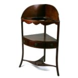 An early 19th century mahogany corner washstand, 59cms wide.