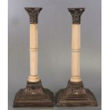 A pair of Victorian silver and ivory Corinthian column style candlesticks on stepped bases decorated