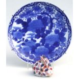 A Japanese Blue and white charger. 37cm diameter, together with an Imari rabbit (2)