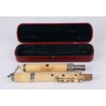 A 19th century ivory flute by Drouet, housed in its original red leather case.Condition ReportOne