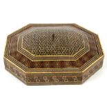 An Indo-Persian Khatam micromosaic lidded box of elongated octagonal form, 30cms wide.